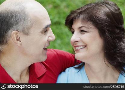 Close-up of a mature couple looking at each other and smiling
