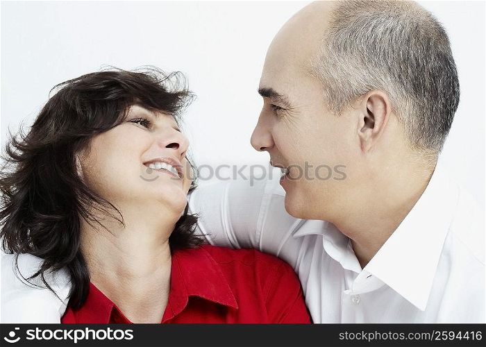 Close-up of a mature couple looking at each other smiling