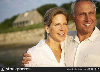 Close-up of a mature couple looking away and smiling