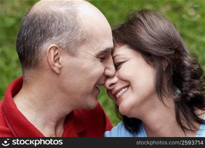 Close-up of a mature couple smiling