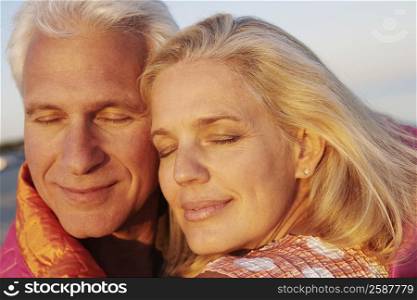 Close-up of a mature couple smirking