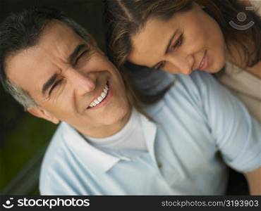 Close-up of a mature man and a mid adult woman smiling