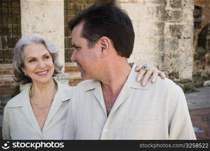Close-up of a mature man and his mother smiling and looking at each other, Santo Domingo, Dominican Republic