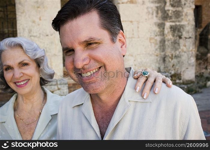 Close-up of a mature man and his mother smiling, Santo Domingo, Dominican Republic