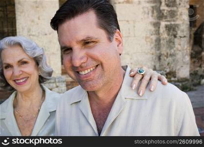 Close-up of a mature man and his mother smiling, Santo Domingo, Dominican Republic
