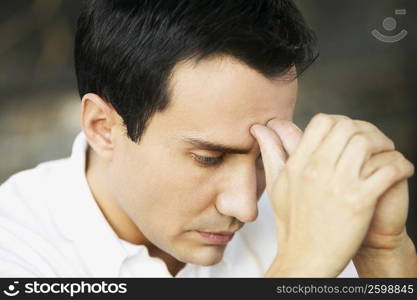 Close-up of a mature man looking pensive