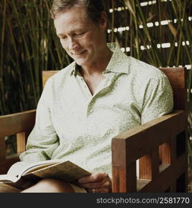 Close-up of a mature man reading a book