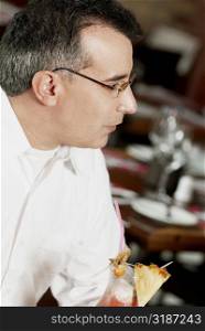 Close-up of a mature man sitting in a restaurant
