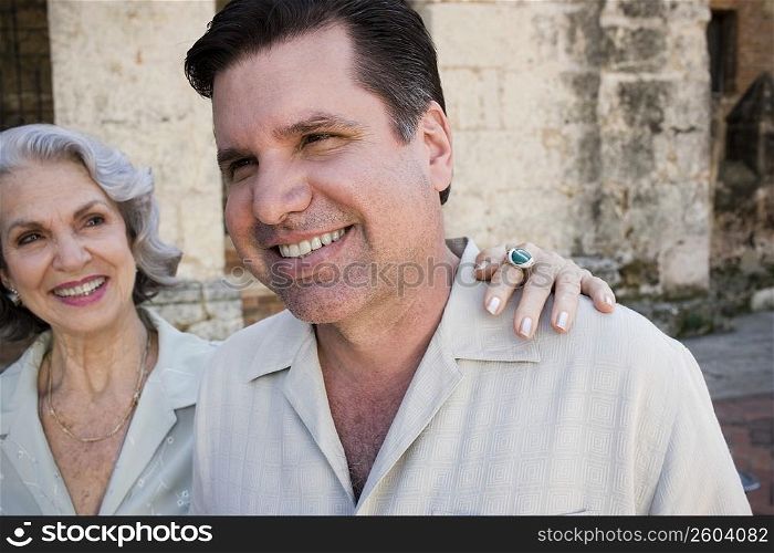 Close-up of a mature man smiling with his mother looking at him, Dominican Republic