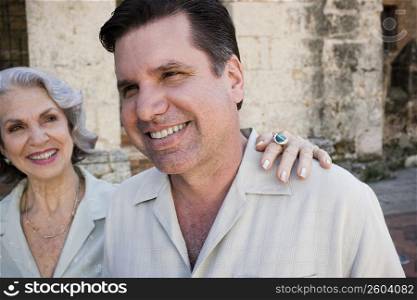 Close-up of a mature man smiling with his mother looking at him, Dominican Republic