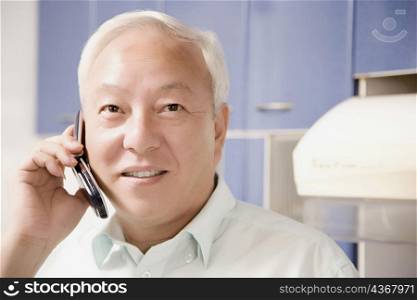Close-up of a mature man talking on a mobile phone