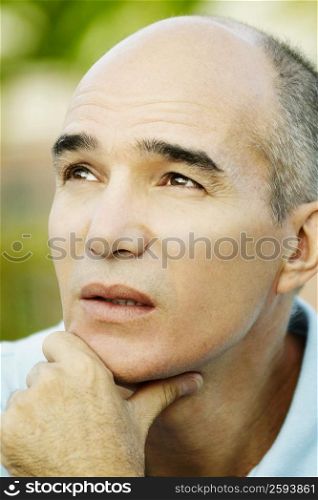 Close-up of a mature man thinking