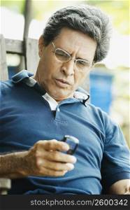 Close-up of a mature man using a mobile phone