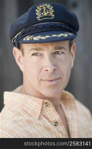 Close-up of a mature man wearing a cap