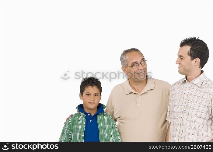 Close-up of a mature man with his son and grandson