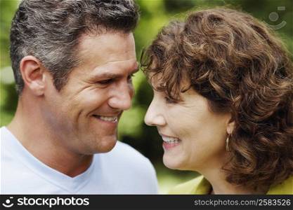 Close-up of a mature woman and a mid adult man smiling