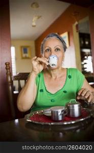 Close-up of a mature woman drinking a cup of tea