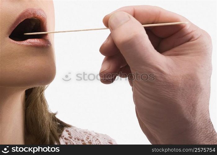 Close-up of a mature woman having a throat examination