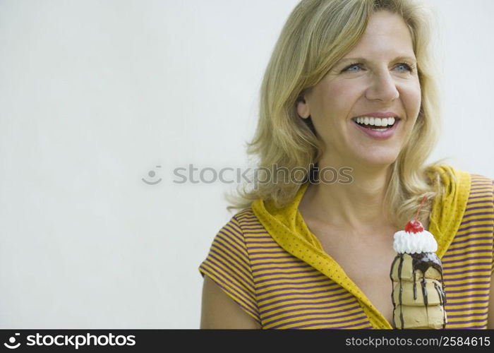 Close-up of a mature woman holding an ice cream cone