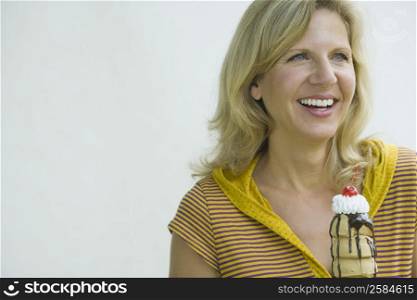 Close-up of a mature woman holding an ice cream cone