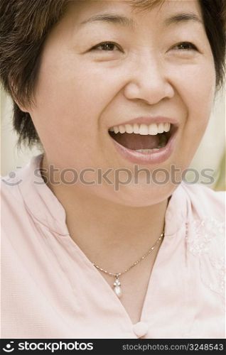 Close-up of a mature woman laughing
