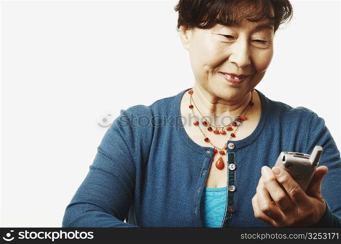 Close-up of a mature woman looking at a mobile phone