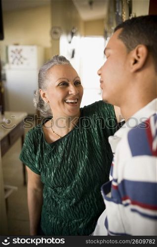 Close-up of a mature woman looking at her grandson and smiling