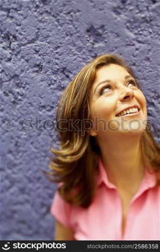 Close-up of a mature woman looking up and smiling