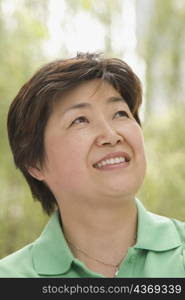 Close-up of a mature woman looking up and smiling