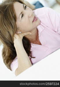 Close-up of a mature woman lying down and looking away