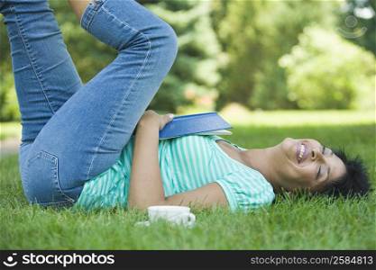 Close-up of a mature woman lying in a lawn