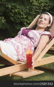 Close-up of a mature woman lying on a chaise lounge