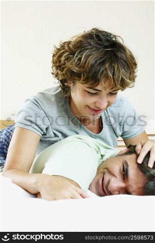 Close-up of a mature woman lying on top of a mature man