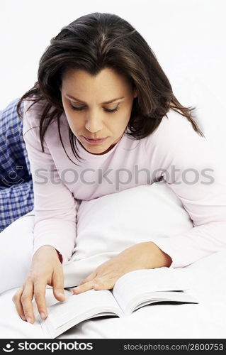 Close-up of a mature woman reading a book