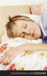 Close-up of a mature woman sleeping on the bed