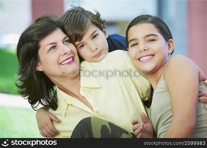 Close-up of a mature woman smiling with her children