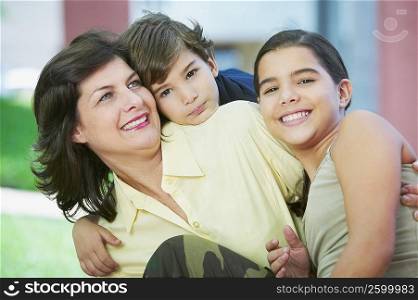 Close-up of a mature woman smiling with her children