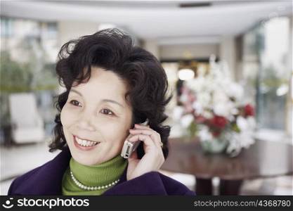 Close-up of a mature woman talking on a mobile phone