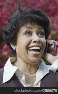 Close-up of a mature woman talking on a mobile phone and smiling