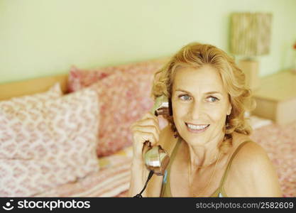 Close-up of a mature woman talking on the telephone