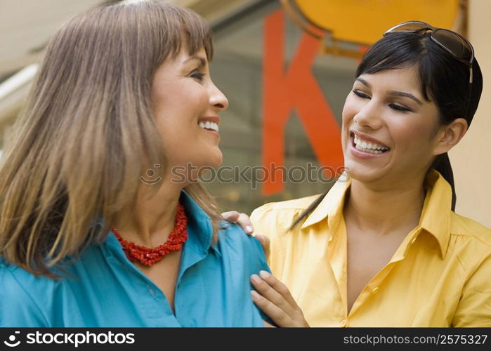 Close-up of a mature woman talking with her daughter