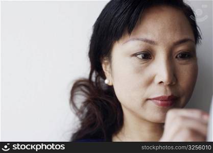 Close-up of a mature woman thinking