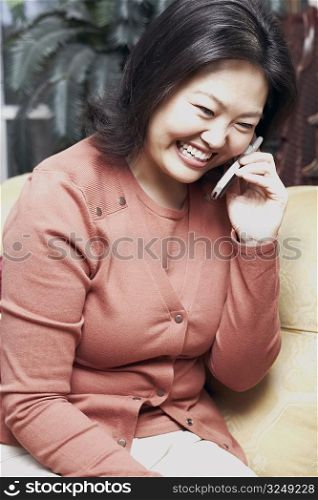 Close-up of a mature woman using a mobile phone