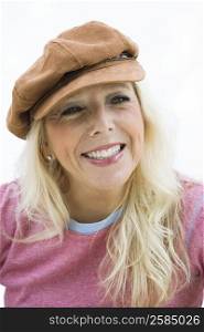 Close-up of a mature woman wearing a cap
