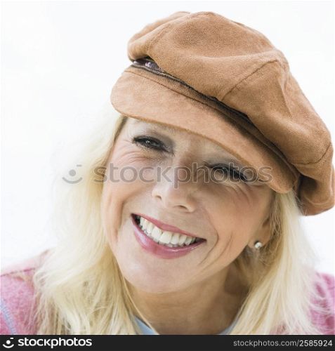 Close-up of a mature woman wearing a cap