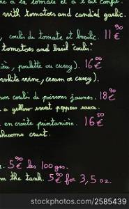 Close-up of a menu list on a blackboard