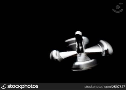 Close-up of a metal knob spinning