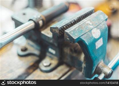 Close up of a metal vice in a garage workshop