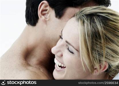 Close-up of a mid adult couple embracing each other