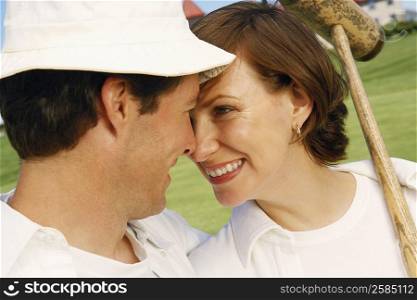 Close-up of a mid adult couple looking at each other and smiling